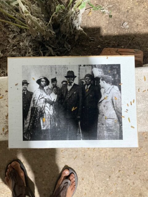 A black and white photo of a group of men Description automatically generated