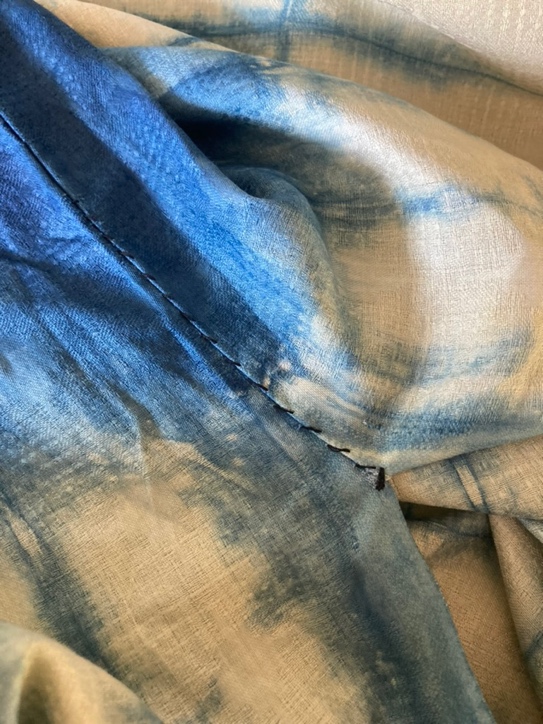 A blue and white fabric with a stitch Description automatically generated