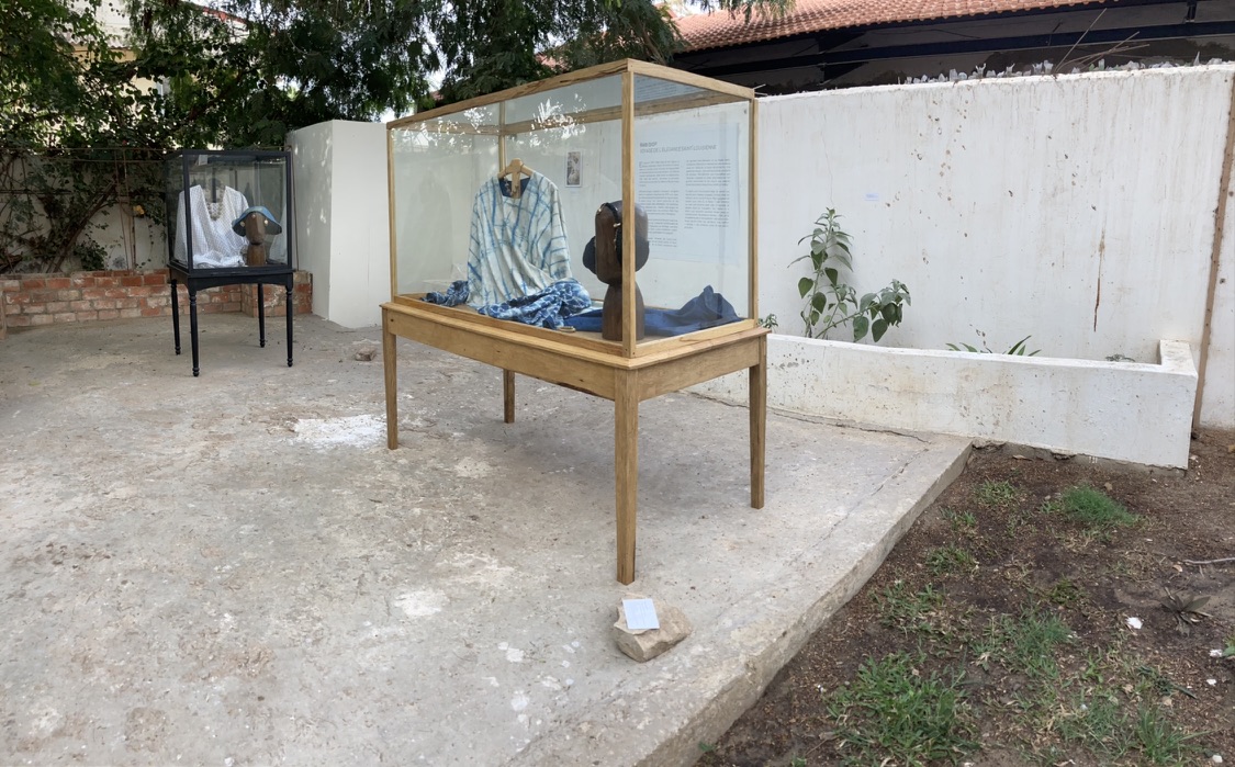 A display case with clothes in it Description automatically generated